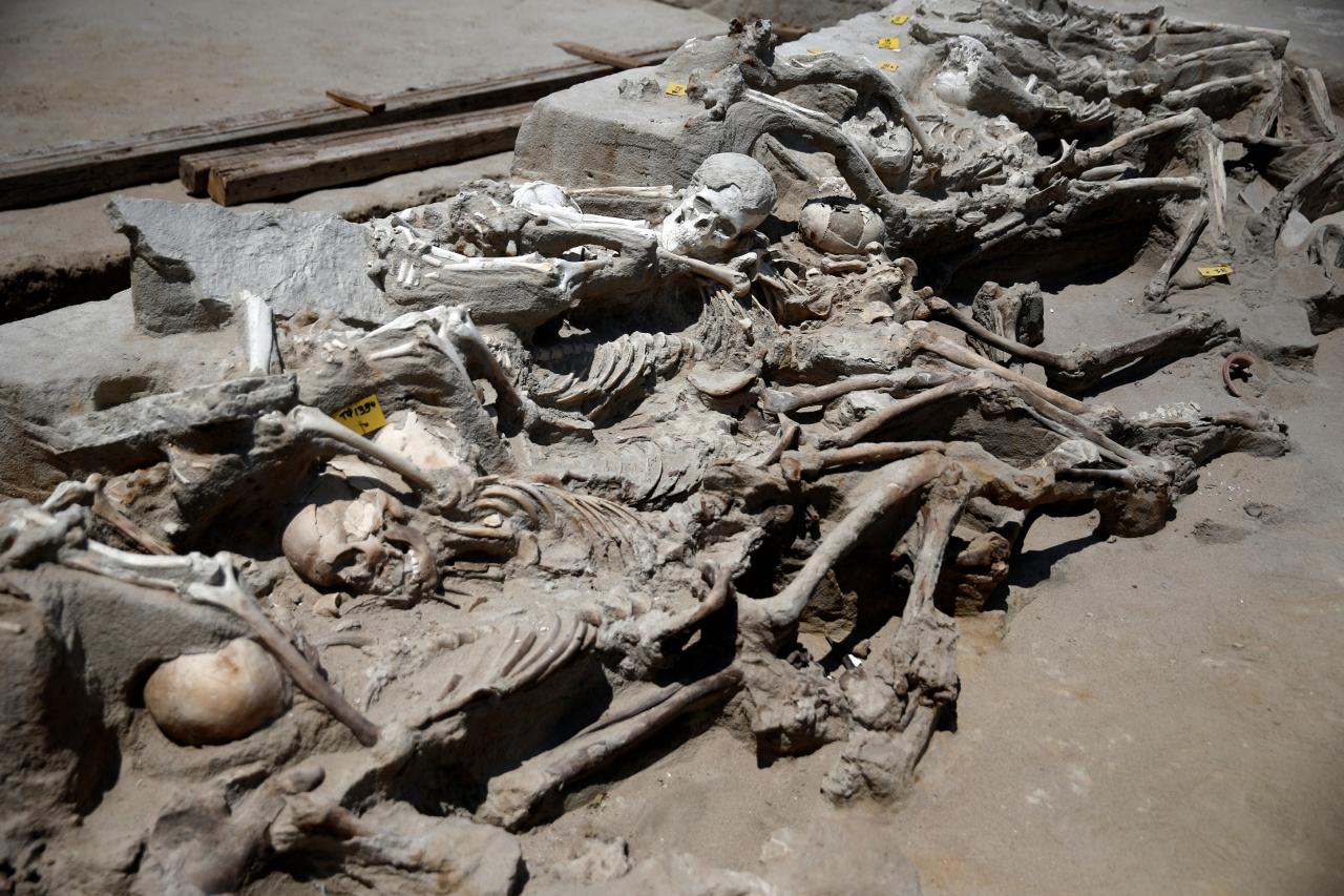  Shackled skeletal remains are piled on top of each other at the ancient Falyron Delta cemetery in Athens