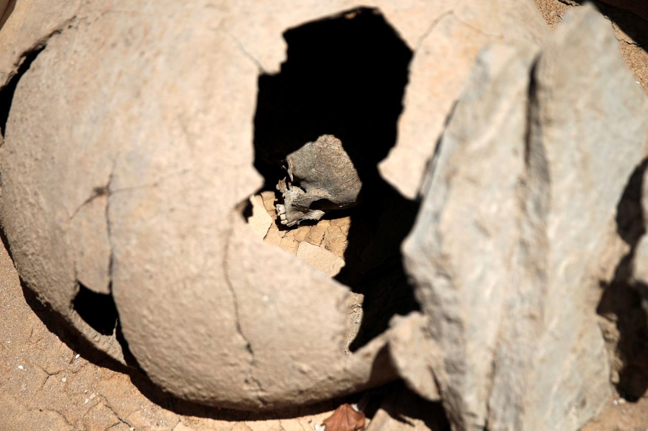  The skull of a child is seen inside a clay jar, a common practice for the burial of babies and children in ancient Greece